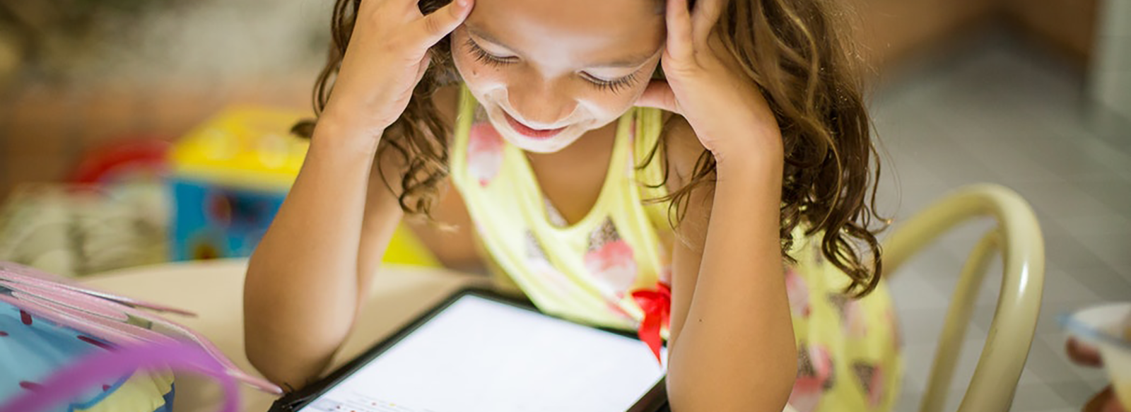 Girl reading on a tablet