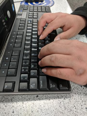 hands on computer keyboard