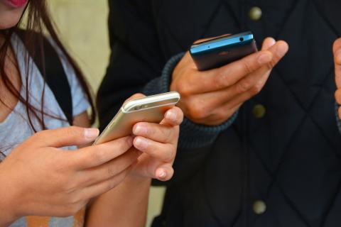 people holding mobile devices