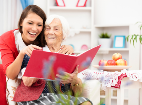 Two women looking at a photo album