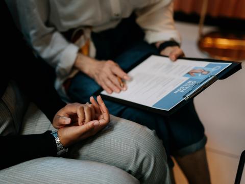 Two people reviewing a resume together