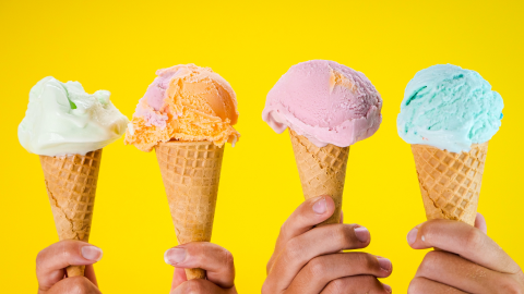 hands holding ice cream cones