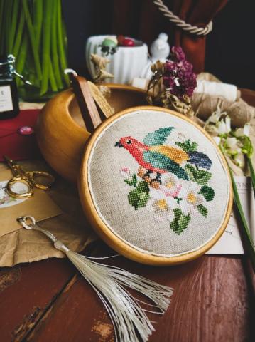 Cross stitched image of a bird