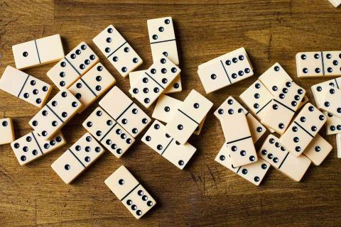 dominoes on a wooden tabletop