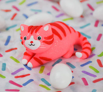 A pink cat made out of clay