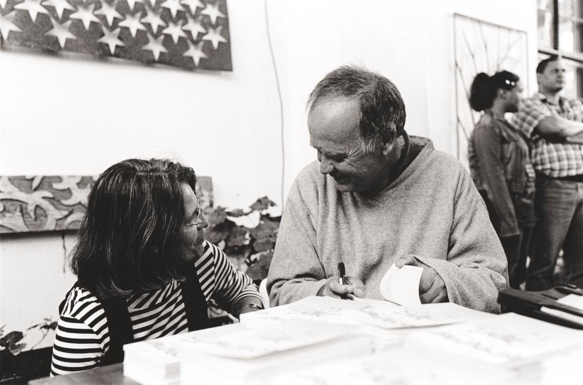 two people talking around a table