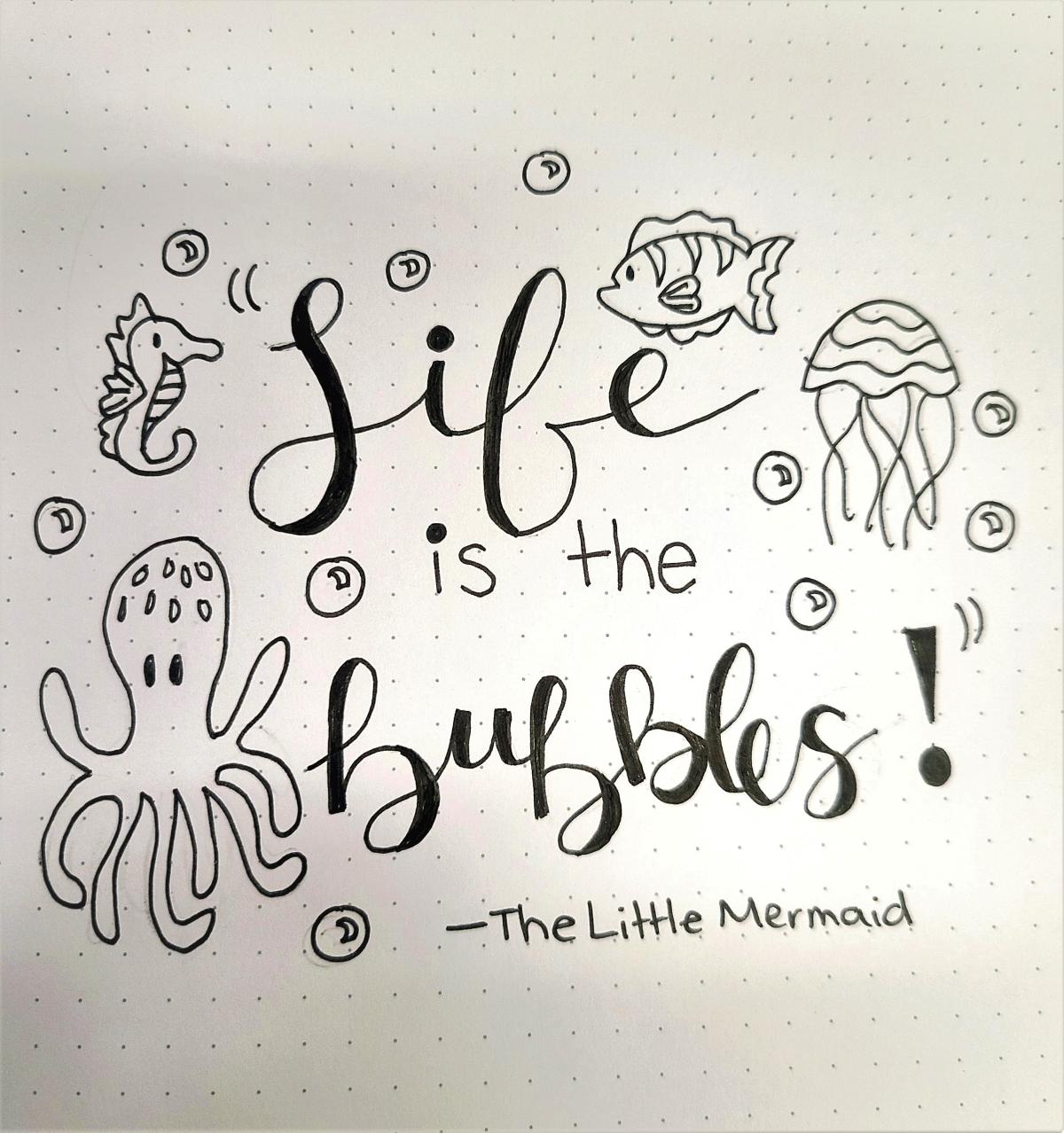 Text reading "Life is the bubbles! - The Little Mermaid" surrounded by sea creatures and bubbles