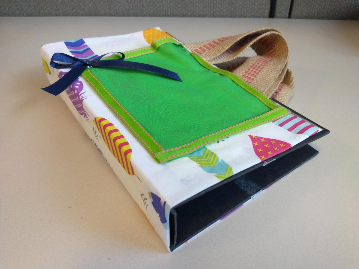 A carrying case made from a book cover