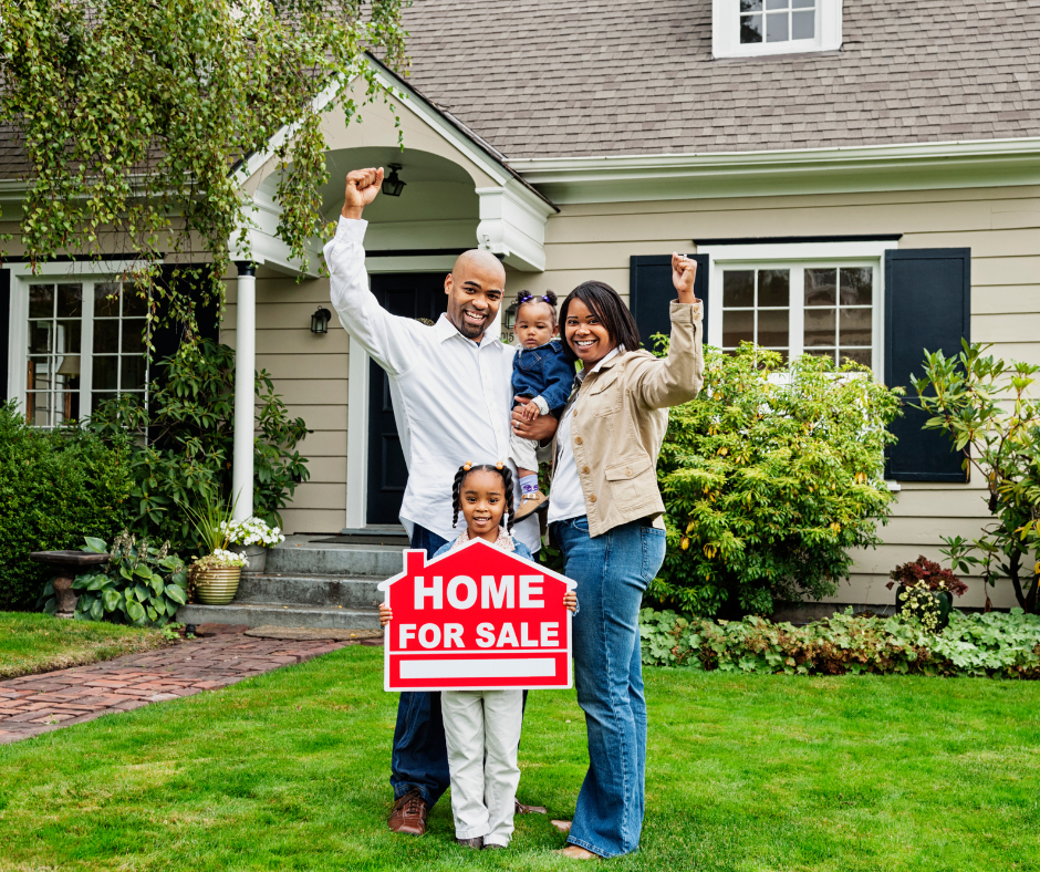 A family in front of a home for sale