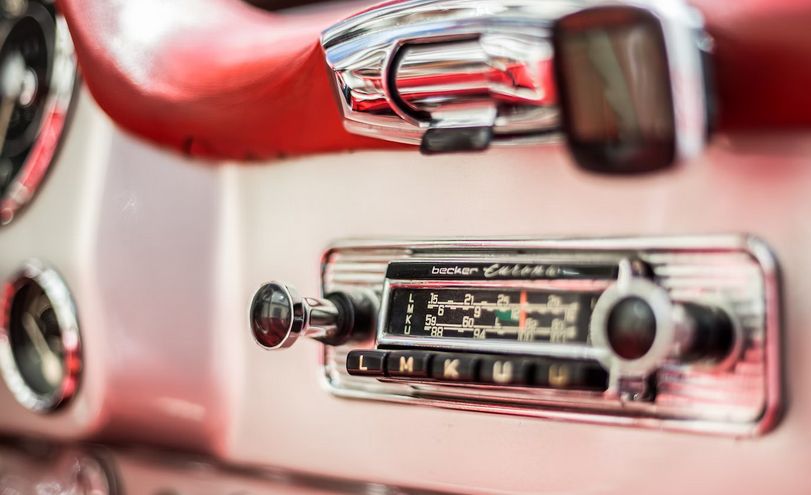 close up of a classic car radio with large dials