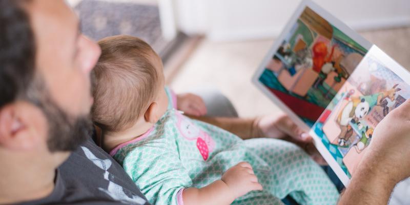 Father reading to baby