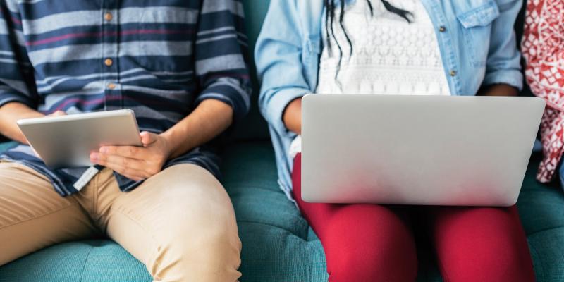 People sitting with laptop and tablet