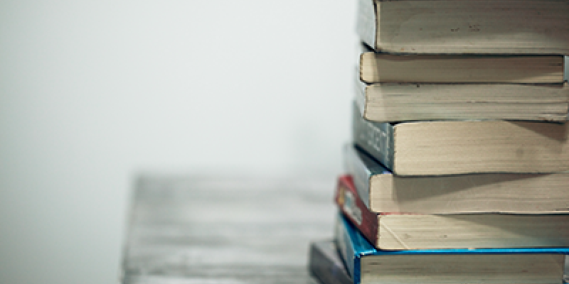 Books stacked on a desk