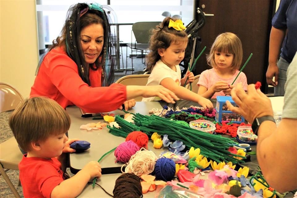 Friends member doing arts and crafts with children